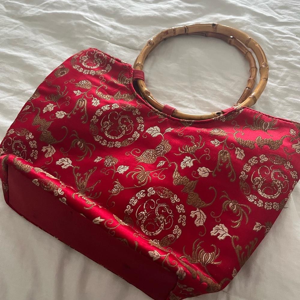 Red Asian oriental purse with bamboo handle